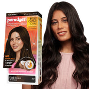 Paradyes Pure Crème Care Dark Brown conditioning hair color shown with model, delivering natural-looking grey coverage, rich true brown tone, and soft, glossy hair with a no-ammonia formula.